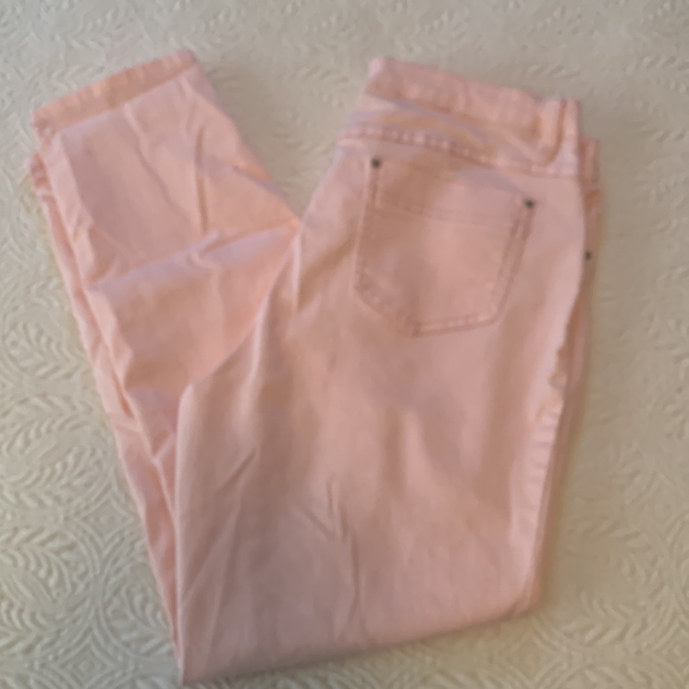 Tribal woman’s cropped jeans.